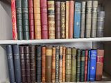 many books on the shelves of a bookcase