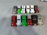 several toy cars are lined up in a row on a table