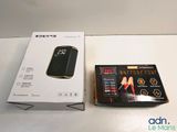 a box with a cell phone in it next to a box of batteries