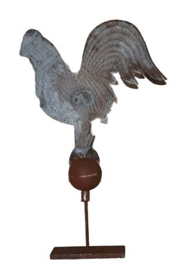 a statue of a bird that is on top of a wooden stand