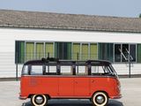 a red and black bus parked in front of a building