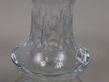 a glass vase that is sitting on a table