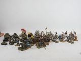 many figurines of different types and sizes on the table
