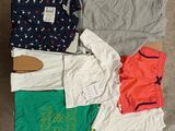 a lot of clothes that are laying out on the floor