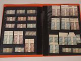 an open book with a lot of stamps on it sitting on a table