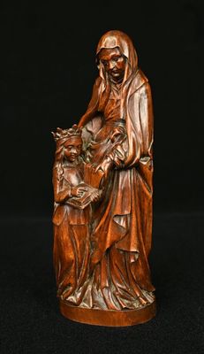 an image of a statue of a woman holding a child
