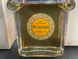 an image of a close up of a bottle of perfume on a table