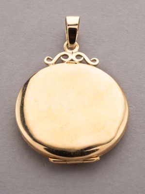 a close up of a gold locke on a gray surface