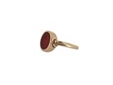 an image of a gold ring with a red stone in the middle