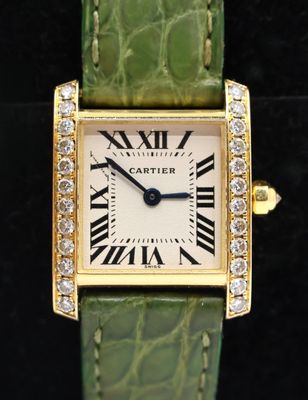 an image of a close up of a wrist watch with diamonds on it