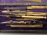 a bunch of tools in a purple case on a table
