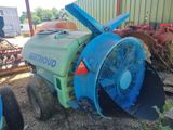 a blue and green tractor with a fan on it