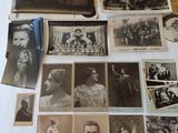 several old photographs of people are displayed on a table