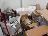 a room with a lot of boxes and other items on the floor