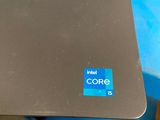 a close up of a laptop on a blue table