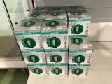 several boxes of toothpaste are stacked on a shelf in a store
