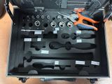 a tool case with tools in it sitting on the floor