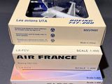 three boxes of air france model airplanes sitting on top of each other