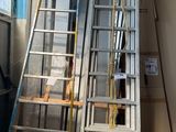 two ladders that are next to each other in a room