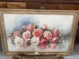 a painting of pink and white roses in a gold frame