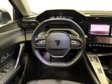 a picture of the interior of a car with a steering wheel and dashboard