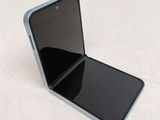 a close up of a cell phone sitting on top of a table