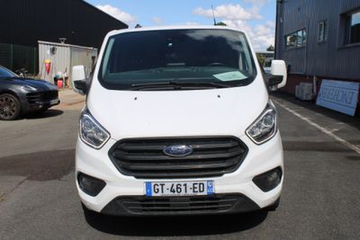 a white van that is parked in a parking lot