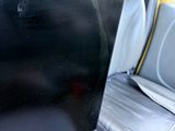 a laptop sitting in the back seat of a car