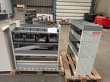 two metal shelves on pallets in a warehouse