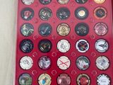 a picture of a red case with a bunch of buttons in it