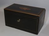 a small black box with a decorative design on it