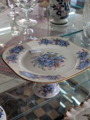 a glass table with plates and glasses on it