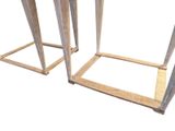 two tables that are made out of wood and have legs