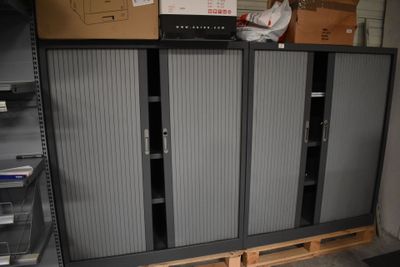 a large metal cabinet in the middle of a room