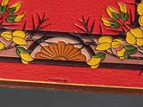 a picture of a red box with yellow flowers on it