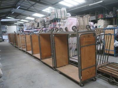 many carts that are lined up in a warehouse