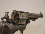 a close up of a gun that is on display