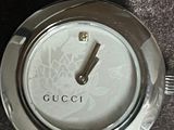 a close up of a wrist watch on a table