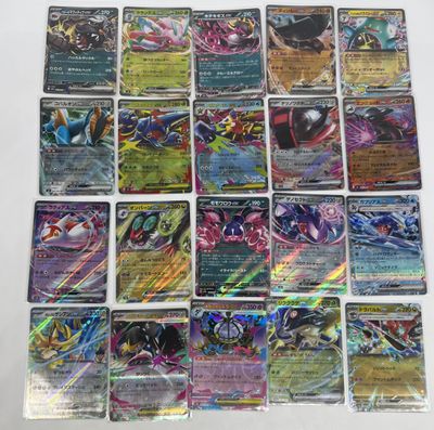 a close up of a bunch of pokemon cards on a table