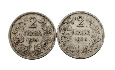 une pièce d'argent sur laquelle figurent le chiffre vingt et la date vingt