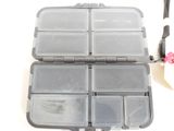 a plastic box with a bunch of compartments inside of it