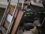 a pile of junk in front of a garage door