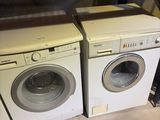 deux lave-linge et un sèche-linge dans un magasin