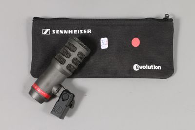a close up of a flashlight and a pouch on a table