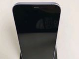 a black phone that is sitting on top of a stand