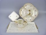 a picture of a tea set on a tray with a cup and saucer
