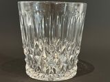 a glass cup that is sitting on a table