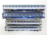 four blue and white train cars stacked on top of each other