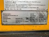 a sign on the side of a yellow machine