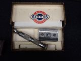 a box with a razor and a razor blade in it